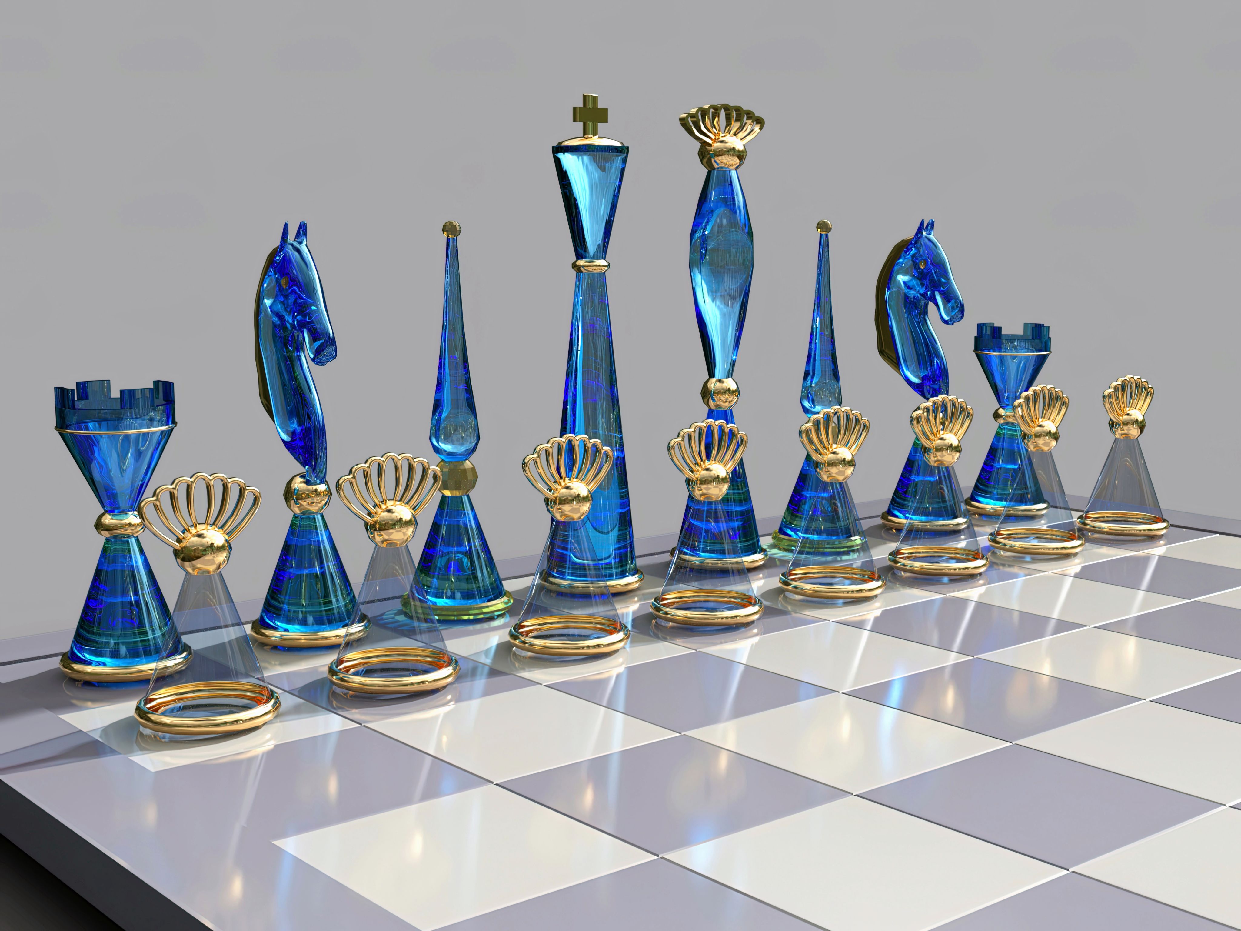 a chess board with blue glass pieces on it